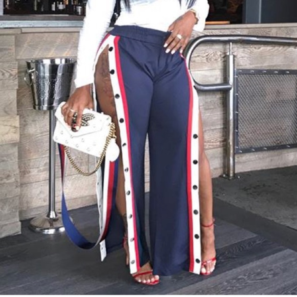 Red snap up track pants